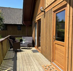 An outdoor area with seating and potted plant at Number 39 in Bodmin