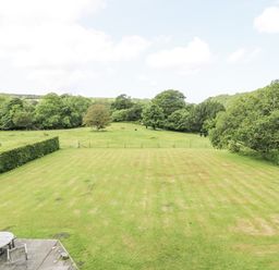 An outdoor area with a table and umbrella at Plas Pontfaen near Fishguard and Newport, Pembrokeshire
