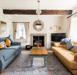 A living room with two sofas and a coffee table at Henhouse Farm in Bodenham