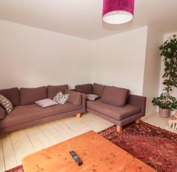 A living room with a sofa and coffee table at Shanti Gher in Bantry