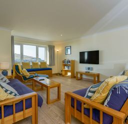 A living room with sofas and a television at Apartment 12, Burgh Island Causeway Bigbury-On-Sea