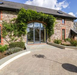 An outdoor area with a stone entrance at Heathcliffe House in Castleton near Cardiff
