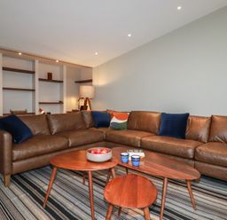 A living room with a sofa and a coffee table at Harberton
