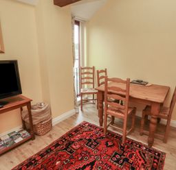 A dining room with a table and chairs at The Hayloft near Wigton
