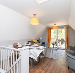 A dining room with a table and chairs at Valley Lodge 37 St Ann's Chapel, Cornwall