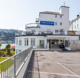 A building with apartments and a sign at 43 The Salcombe in Salcombe