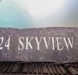 A slate sign with the number 24 and the text Skyview