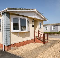A house exterior with a pathway and steps at Lazy Days in St Merryn