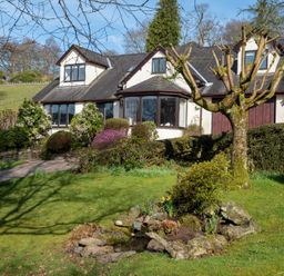 A house with garden and pathway at Marina View in Bowness-On-Windermere