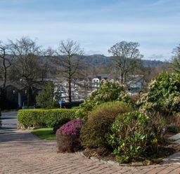 An outdoor area with bushes and trees at Marina View Bowness-On-Windermere