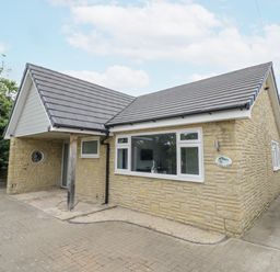 A house with a pathway and garage at Chillon in South Littleton near Honeybourne
