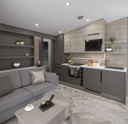 A living area with a gray sofa, wooden coffee table, shelves with plants, and a kitchen with stove, microwave, and sink at Elter Luxury Pod in Keswick