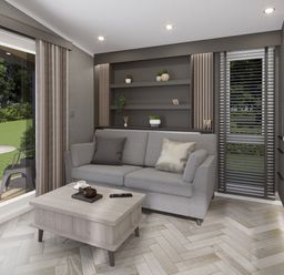 A living room with a grey sofa and coffee table next to a sliding glass door at Hodge Luxury Pod in Keswick