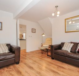 A living room with sofas and an armchair at Kernyk Camelford
