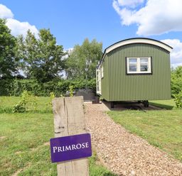 A shepherd's hut with a sign at Primrose in Grimsby