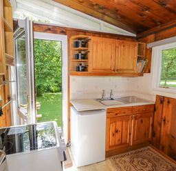 A kitchen with cabinets and a sink at Ty Bedwen in Dinas Mawddwy