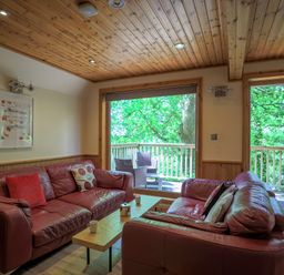 A living room with a sofa and coffee table at Lodge 68 - Fern Gully, Finlakes Holiday Park near Chudleigh