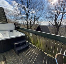 A hot tub on a deck at Tor View Finlakes Holiday Park near Chudleigh