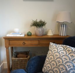 A living room with a table and lamp at Glendale near Trelights near Port Isaac