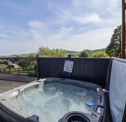 A hot tub with a view in an outdoor area at Birch Cottage in Scarborough