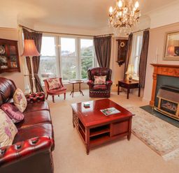 A living room with a coffee table and sofa at High Cross in Keswick