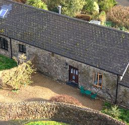 A building with a door and windows surrounded by a garden at 8 Rogeston Cottages Haverfordwest