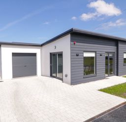 A modern single-story house with a garage and paved driveway at Number 2 Villa - The View in Derrybeg County Donegal