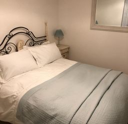 A bedroom with a bed and lamp at Pen Y Ffrith Lodge in Prestatyn