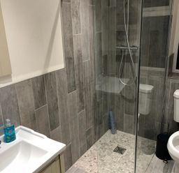 A bathroom with a shower and toilet at Pen Y Ffrith Lodge in Prestatyn