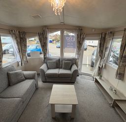 A living room with a sofa and coffee table at Caravan 941 Clacton-On-Sea