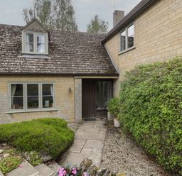 An outdoor entrance with a door and window at St. Marys House Church Westcote near Bledington