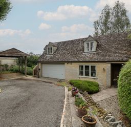 An outdoor area with a house and garage at St. Marys House Church Westcote near Bledington