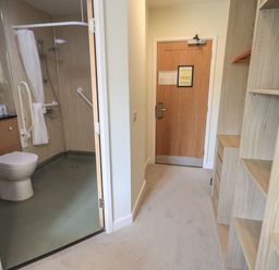 A bathroom with a toilet and shower at Eamont Park First-floor Double Bedroom in Penrith