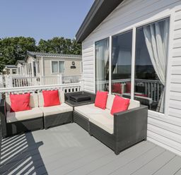 An outdoor seating area with a sofa and table at Number 42 Wemyss Bay