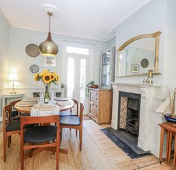 A dining room with a table and chairs at 18 Pakefield Road in Lowestoft