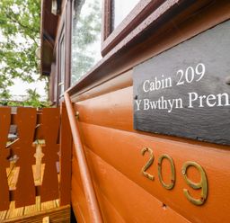 A cabin sign at Y Bwthyn Pren, Cabin 209, Trawsfynydd