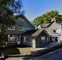 A street view showing shops and trees at Cumbria house in Grasmere