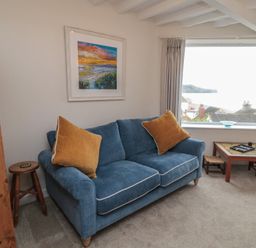 A living room with a sofa and coffee table at Iveridge in Sandsend