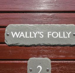 A sign displaying Wally's Folly at Limefitt Park near Troutbeck
