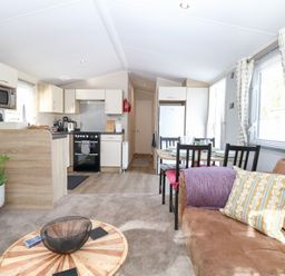 A living room with a kitchen and dining area at Number 34 Foxburrow Hang in Great Yarmouth