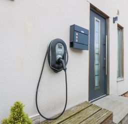 A front entrance with an electric vehicle charger and mailbox at Shearwater Rhosneigr