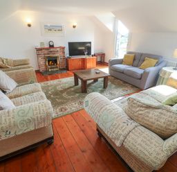 A living room with sofas and a coffee table at The Cottage in St. Ives