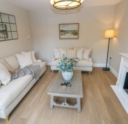 A living room with sofas and a coffee table at Hafan Y Gof in Newcastle Emlyn