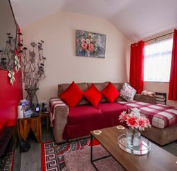 A living room with a sofa and coffee table at Sandbay in Bridlington