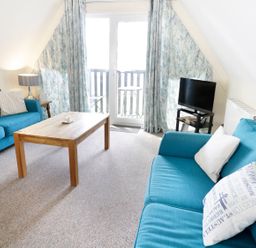 A living room with a sofa and coffee table at Valley Lodge 2 in Callington