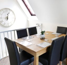 A dining room with a table and chairs at Valley Lodge 2 Callington
