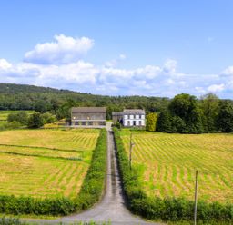 A rural landscape with buildings and fields at Grove House in Grange-Over-Sands