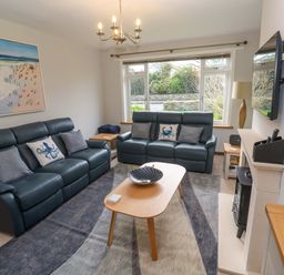 A living room with sofas and a coffee table at Byron’s Retreat in Crantock