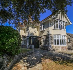 A house with a pathway and garden at Purbeck Vista in Swanage