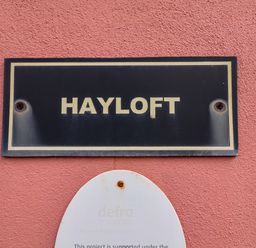 A sign displaying the name Hayloft at Hayloft in Ipswich